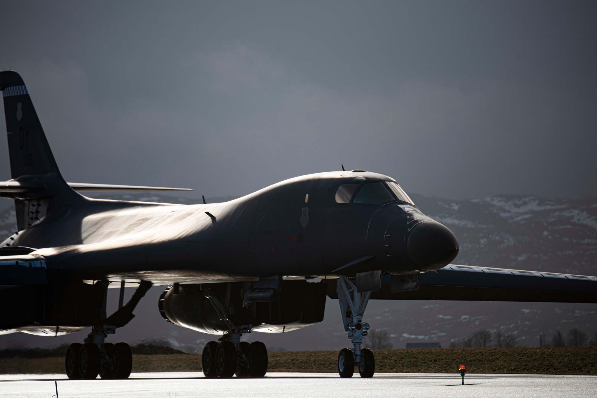 A B-1B Lancer assigned to the 9th Expeditionary Bomb Squadron taxis on the flightline at Ørland Air Force Station, Norway, Feb. 26, 2021. During Arctic Bone, two B-1’s conducted local integration training with a U.S. Navy P-8 Poseidon, a Royal Norwegian air force F-35 Lightning and a Royal Norwegian navy Skjold-class Corvette ship. (U.S. Air Force photo by Airman 1st Class Colin Hollowell)