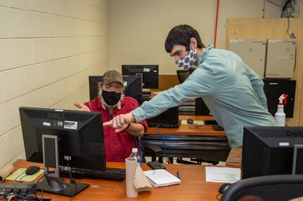 (From right to left)  Code 300’s MSE Deputy Kyle Alexander showing Scheduler Bruce Neel one of the MSE’s abilities.