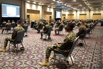 U.S. Marines and U.S. Navy Sailors assigned to Combat Logistics Battalion 22 (CLB-22) receive a joint reception, staging, onward movement, and integration (JRSOI) brief during the setup of the state-run, federally-supported COVID-19 Community Vaccination Center  at the Pennsylvania Convention Center in Philadelphia, Feb. 27, 2021.