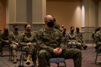 U.S. Marines and U.S. Navy Sailors assigned to Combat Logistics Battalion 22 (CLB-22) receive a joint reception, staging, onward movement, and integration (JRSOI) brief during the setup of the state-run, federally-supported COVID-19 Community Vaccination Center at the Pennsylvania Convention Center in Philadelphia, Feb. 27, 2021.