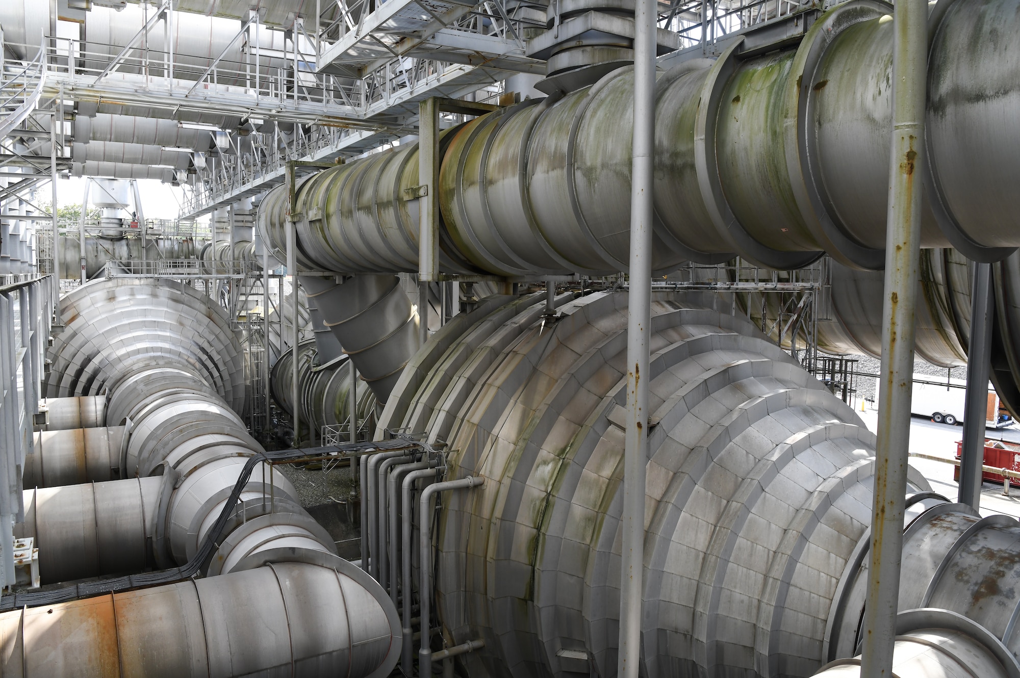 Exhaust of engines tested in the C Plant of the Engine Test Facility at Arnold Air Force Base, Tenn., can reach 3,000 degrees Fahrenheit and must be kept at altitude conditions in the test cells for accurate testing. The exhaust must be cooled before entering the exhauster system and then vented to the atmosphere. Ductwork of the exhauster system of C Plant is shown here Oct. 15, 2020. (U.S. Air Force photo by Jill Pickett)