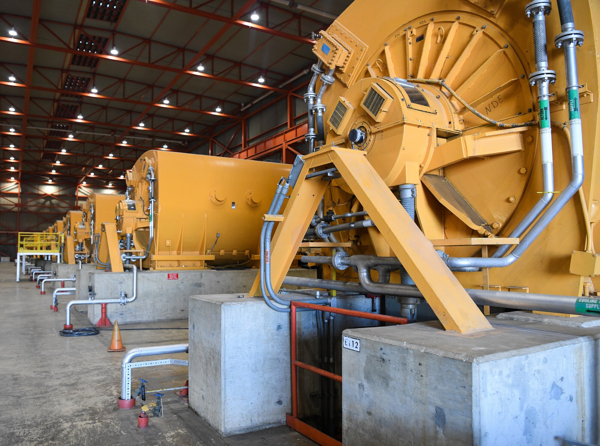 Exhauster motors in the C Plant of the Engine Test Facility at Arnold Air Force Base, Tenn., shown here Oct. 15, 2020, power compressors that pull air through the test cells to create low-pressure altitude test conditions. (U.S. Air Force photo by Jill Pickett)