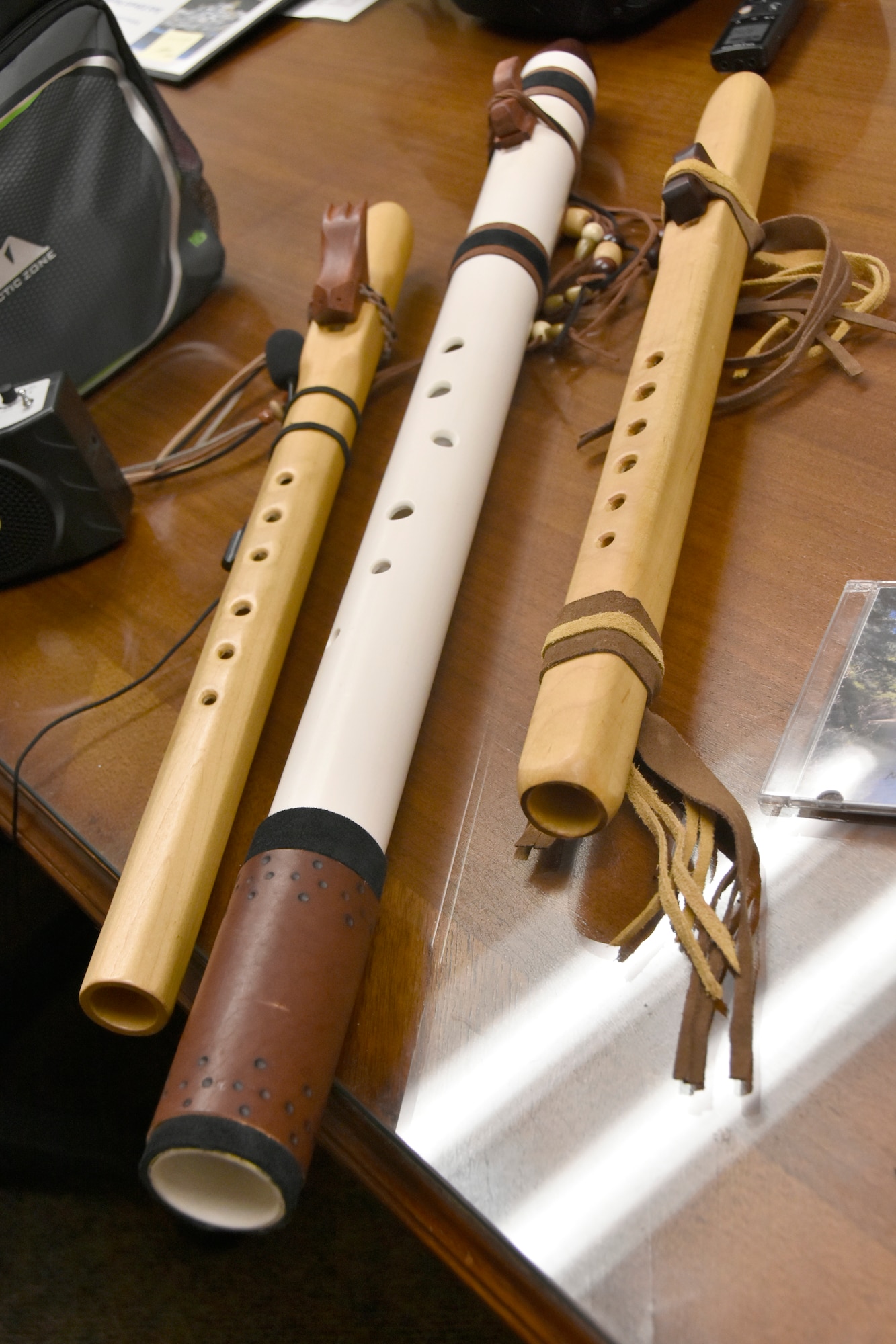 Three of the Native American flutes made by Kevin Ashley, an inside machinist with the Arnold Engineering Development Complex Model and Machine Shop at Arnold Air Force Base, Tenn., are pictured here. Ashley has been making his own flutes for more than a decade. Two of the flutes are made from maple, while Ashley made the bass flute in the center from PVC pipe. (U.S. Air Force photo by Bradley Hicks)