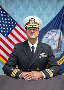 Studio portrait of Cmdr. Eric K. Rolfs