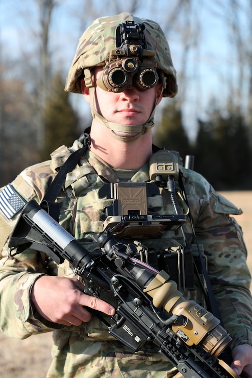 A Soldier from the 2-506, 101st Airborne Division dons the Enhanced Night Vision Goggle (ENVG-B), Nett Warrior, and Family of Weapons Sight – Individual (FWS-I) during a Soldier Touchpoint event at Aberdeen Proving Ground, MD in February 2021.