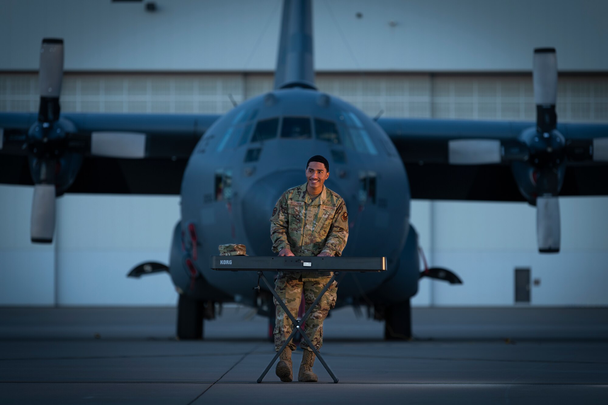 Airman 1st Class Josiah Beecham, 27th Special Operations Aircraft Maintenance Squadron electrical and environmental apprentice, plays the piano on the flightline in front of an AC-130W Stinger II at Cannon AFB, N.M., February 25th, 2021. As an electrical and environmental apprentice, Beecham regularly works on the AC-130W Stinger II. In addition to functioning as an aircraft maintainer, Beecham says making music is his favorite thing to do, and he hopes to become a released artist in the future. (U.S. Air Force photo by Airman 1st Class Christopher Storer)
