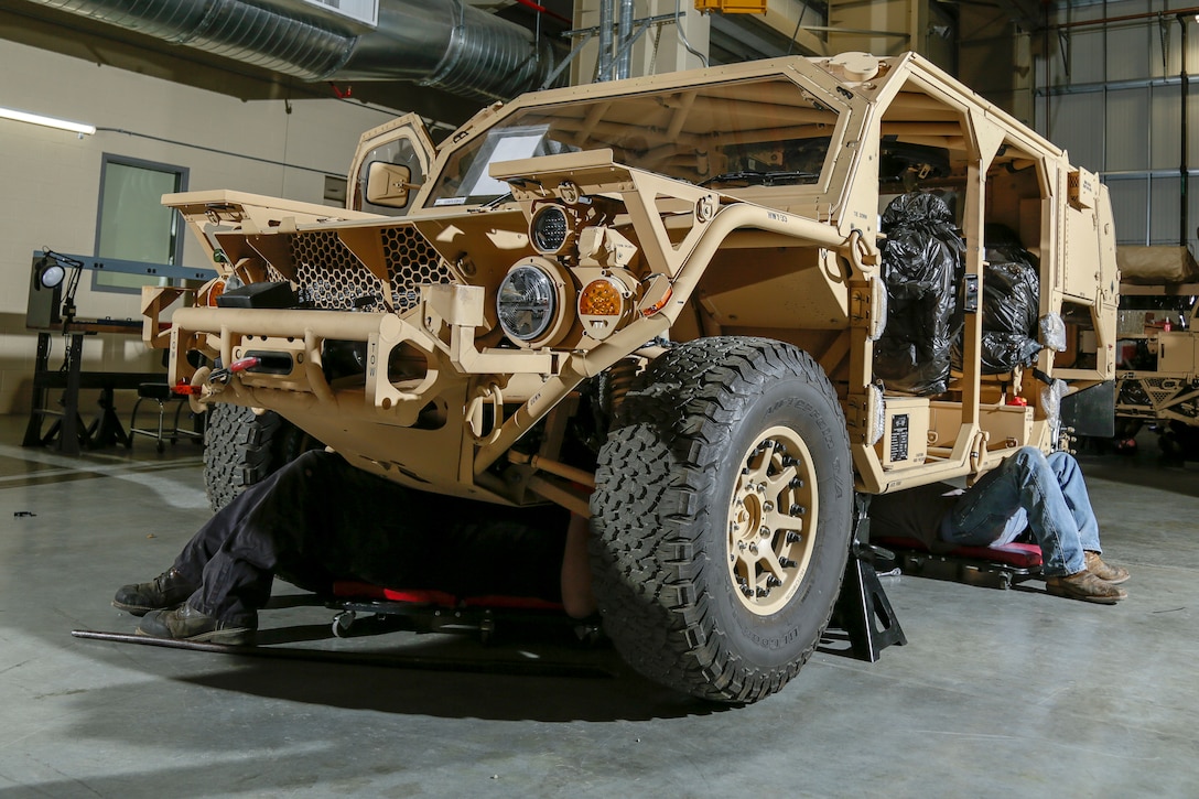 Heavy Mobile Equipment mechanics work together with mechanics from the original equipment manufacturer, Flyer Defense, to learn every aspect of maintenance and repair of the Special Operations’  Ground Mobility Vehicle at Production Plant Barstow, Marine Depot Maintenance Command, aboard the Yermo Annex of Marine Corps Logistics Base Barstow, Calif., Feb. 24.