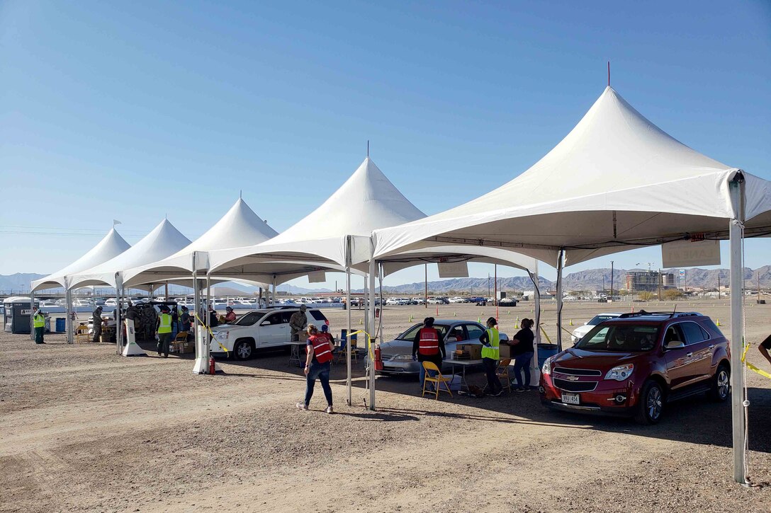 Cars line up for COVID-19 vaccinations.