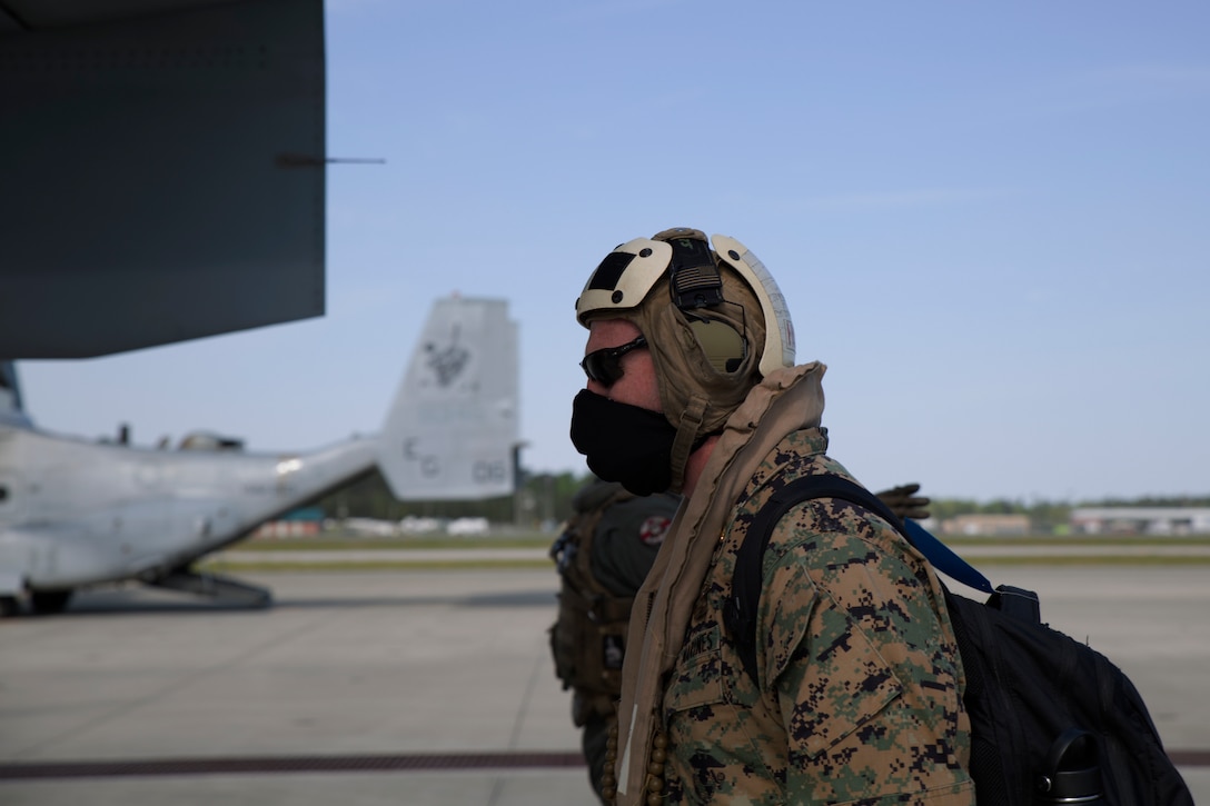 A Marine with 2nd Marine Expeditionary Brigade, II Marine Expeditionary Force, boards an MV-22B Osprey as they prepare for takeoff from the flight line at Marine Corps Air Station New River, N.C., April 10, 2020. The Marines are deploying to assist the Federal Emergency Management Agency in response to the COVID-19 pandemic. (U.S. Marine Corps photo by Cpl. Heather Atherton)