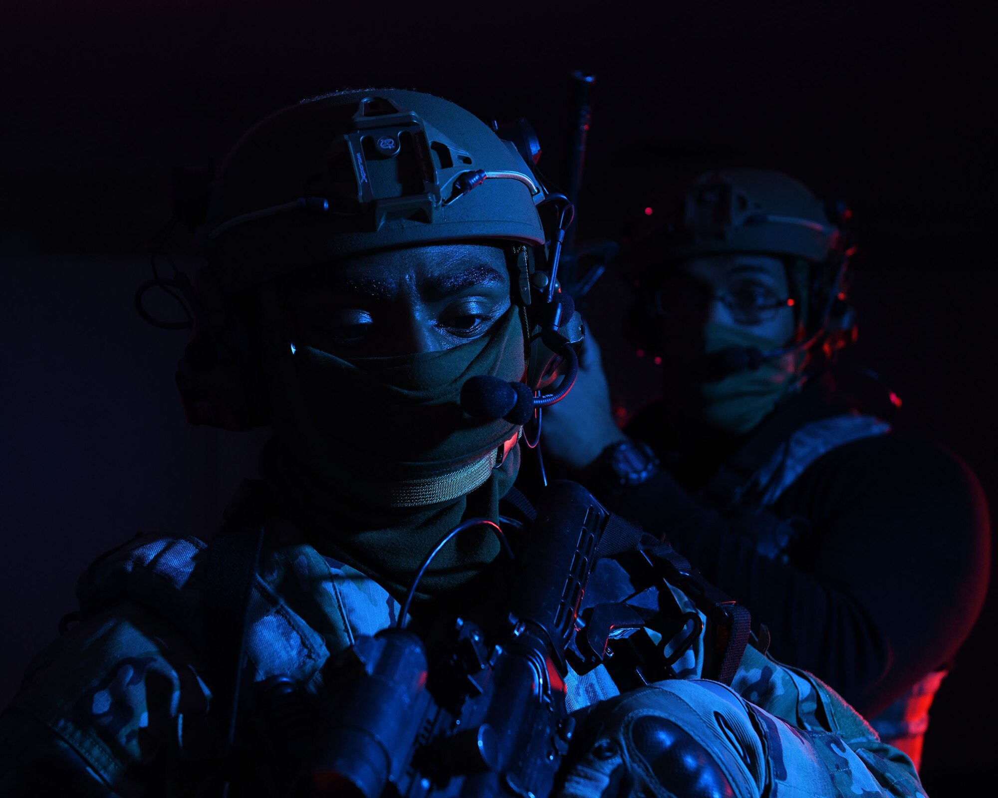 Airmen from the 460th Security Forces Squadron stand guard at a door during a training exercise at Buckley Air Force Base, Colo., Feb. 17, 2021. The 460th SFS teamed up with Aurora Special Weapons and Tactics Team for a training exercise at the shoot house. (U.S. Space Force photo by Airman 1st Class Haley N. Blevins)