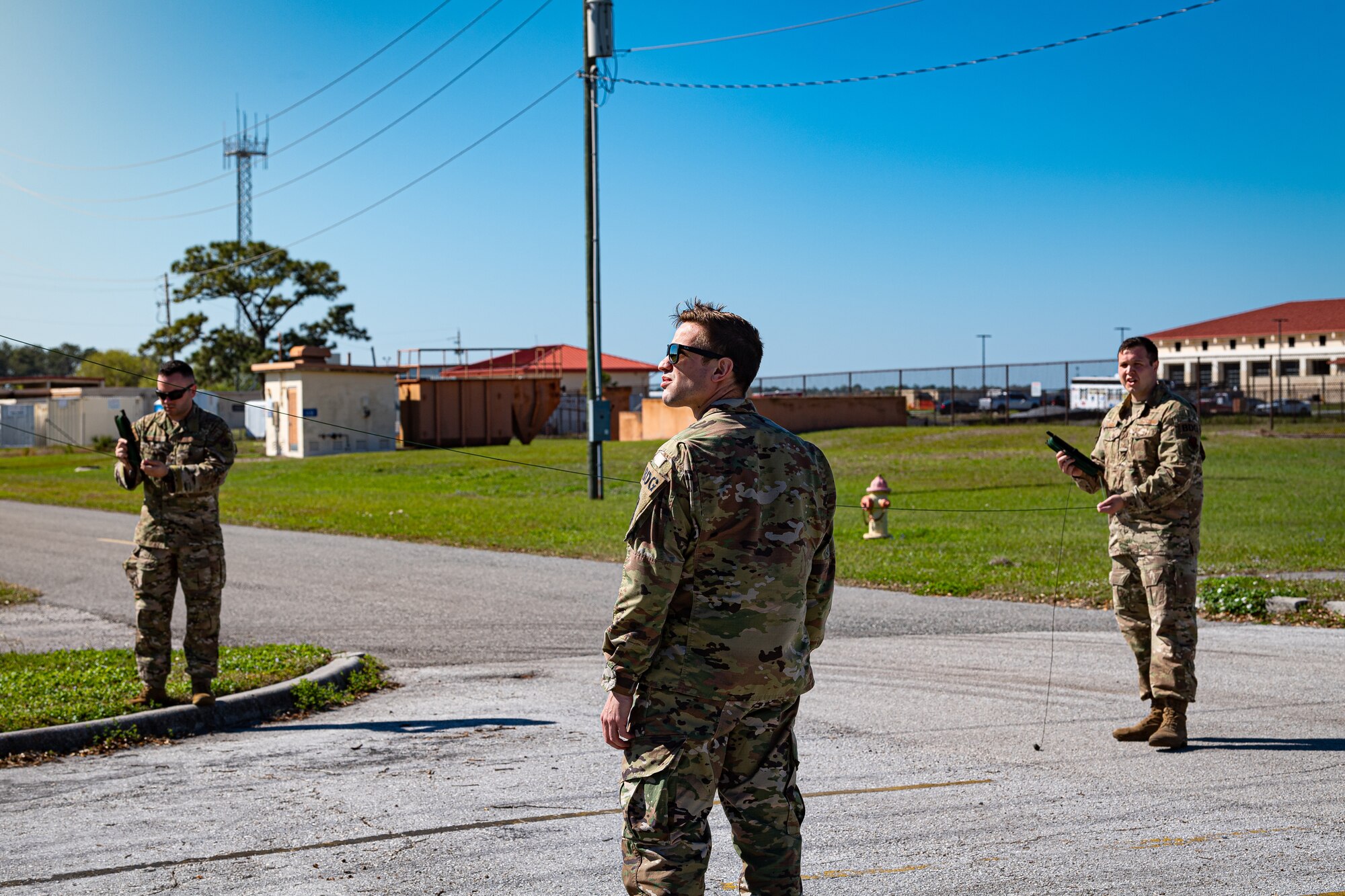 A photo of Airmen constructing an antenna