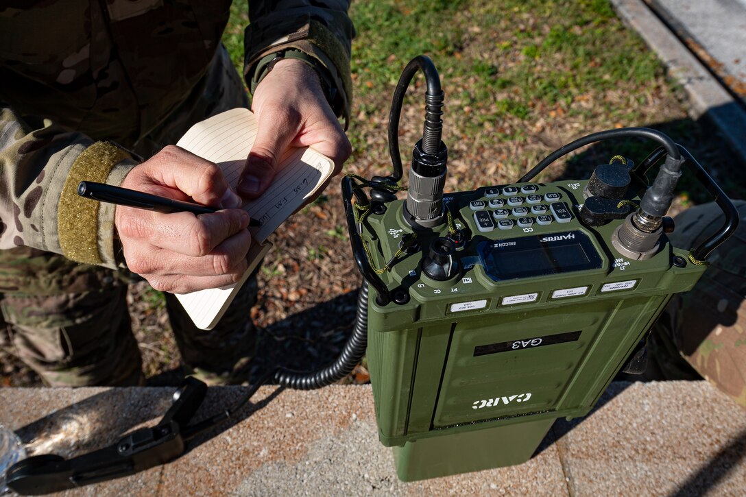 A photo of an Airman taking notes