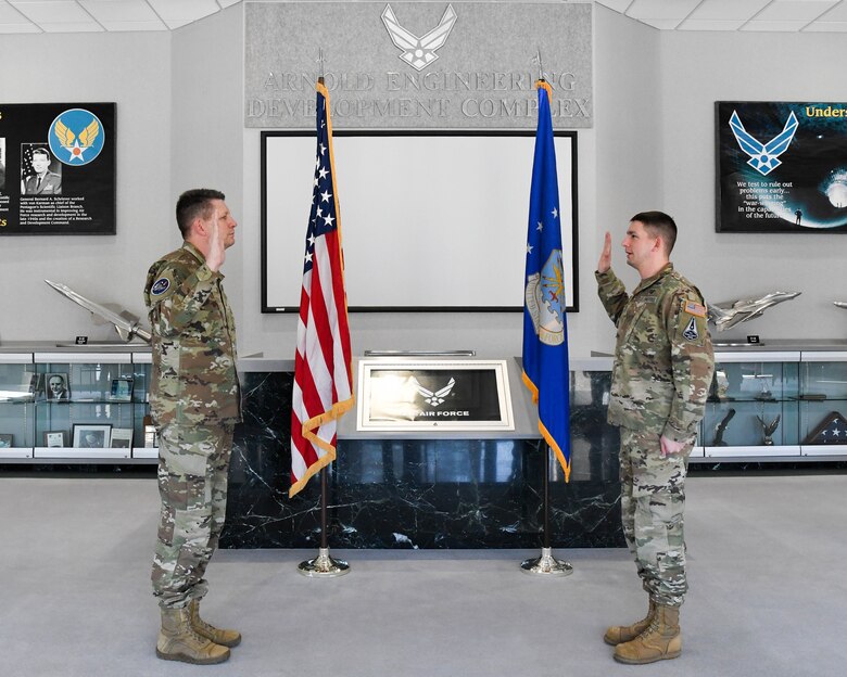Gen. David Thompson, left, vice chief of Space Operations, United States Space Force, swears in 2nd Lt. Michael Hareld to the Space Force during a ceremony at Arnold Air Force Base, Tenn., headquarters of Arnold Engineering Development Complex, Feb. 5, 2021. Hareld transfered from the Air Force to the Space Force. (U.S. Air Force photo by Jill Pickett)
