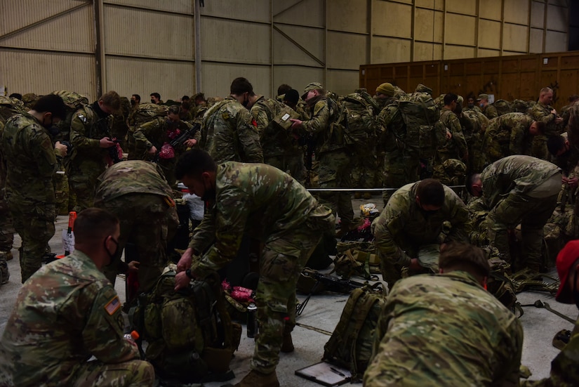 Soldiers from the 82nd Airborne Division from Fort Bragg, North Carolina, prepare their gear as part of Immediate Response Force training Feb. 1, 2020 at Joint Base Charleston, South Carolina. The IRF is a rap-id reaction force jointly maintained by the United States Army and United States Air Force. The purpose of the IRF movement at Joint Base Charleston was to project ready forces, available to deploy at any given moment. Approximately 4,000 soldiers and Airmen participated in the training.