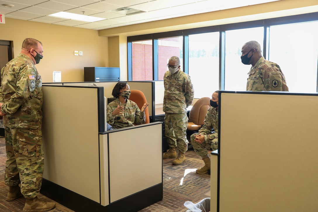 A group of soldiers in an office.