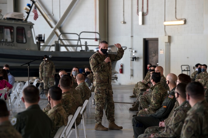 Chief Master Sgt. Chad W. Bickley, 18th Air Force command chief master sergeant, briefs during an all call at Joint Base Charleston, S.C., Feb. 25, 2021.