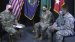 Maj. Gen. Greg Knight speaks with Staff Sgt. Selena Correa and Air Force Tech. Sgt. Kirby Addison about steps the Vermont National Guard is taking to increase inclusion within its ranks at Camp Johnson, Vermont, Feb. 25, 2021. Correa and Addison are special emphasis program managers with the Vermont Army National Guard and Vermont Air National Guard. Knight is the state adjutant general. (U.S. Army National Guard photo by Don Branum)