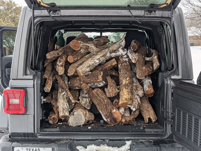 Firewood secured and donated from a local community member is packed into a vehicle in San Angelo, Texas, Feb. 15, 2021. The 17th Training Group commanders and base members worked together and delivered wood to families without power so they could heat their homes. (Courtesy photo)