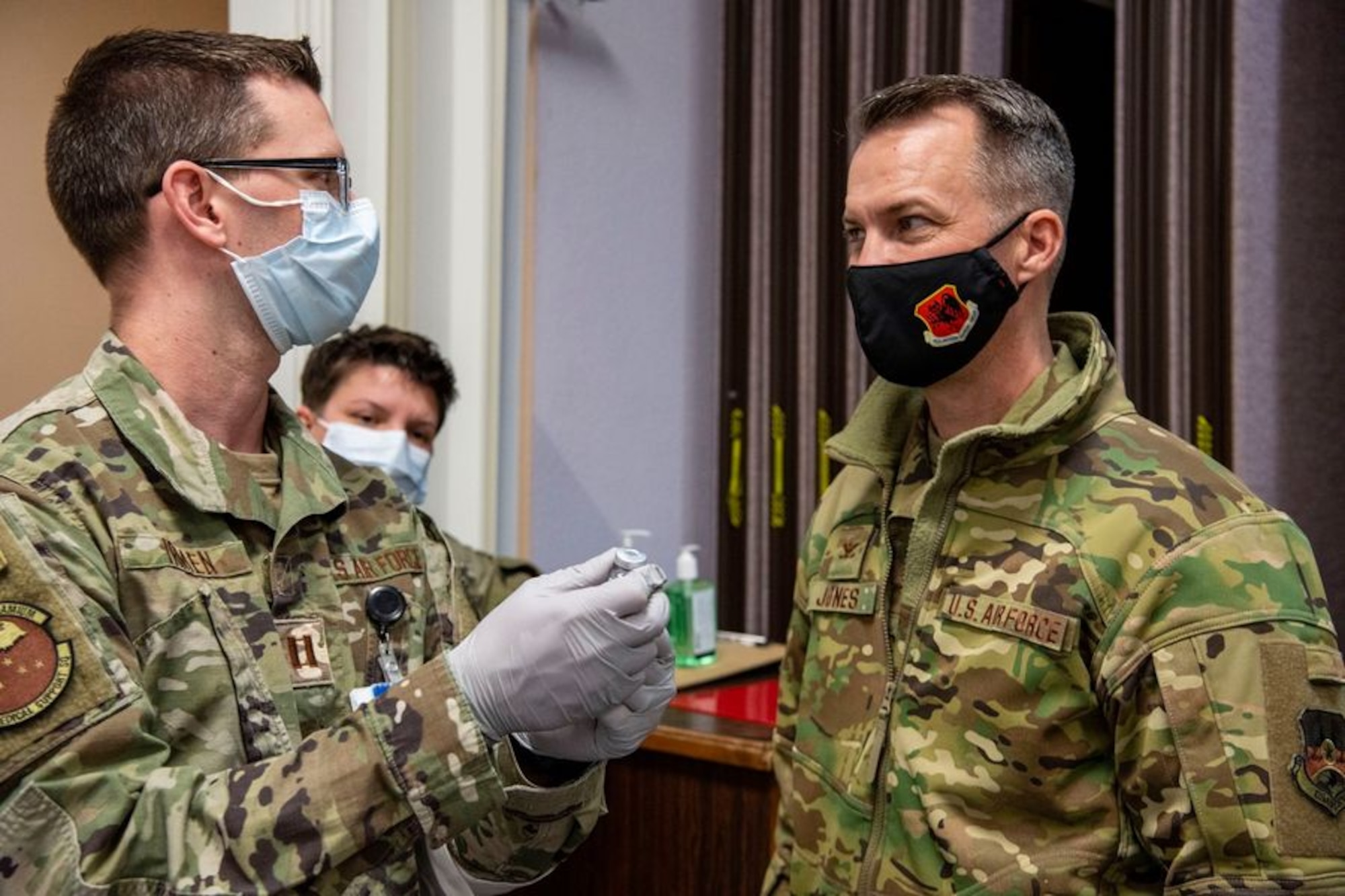 Col. Stephen R. Jones, 432nd Wing/432nd Air Expeditionary Wing commander, receives a briefing about the vaccination procedures at Nellis Air Force Base.