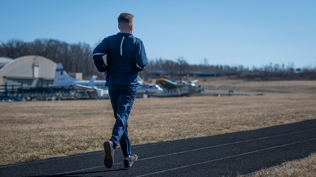 Air Force Uniform Office member 2nd Lt. Maverick Wilhite puts parts of the updated Air Force physical training (PT) uniform through their paces at Wright-Patterson Air Force Base, Ohio, Feb. 25, 2021.  The Air Force Uniform Office is part of the Human System's Division in the Air Force Life Cycle Management Center's Agile Combat Support Directorate. This is the first update to the PT uniform in more than 16 years, and over 150 Airmen participated in testing the new gear. The new ensemble currently consists of a jacket, a pair of pants, a T-shirt and two types a shorts; a lined runners short and a longer unlined multipurpose short. A long sleeve t-shirt and a hoodie in development. The ensemble features improved fabrics that are softer and quick drying, and have antimicrobial technology, which  helps with moisture and odor control. The new uniform items are entering the production phase and will be available to Airmen sometime in 2022. (U.S. Air Force photo by Jim Varhegyi)