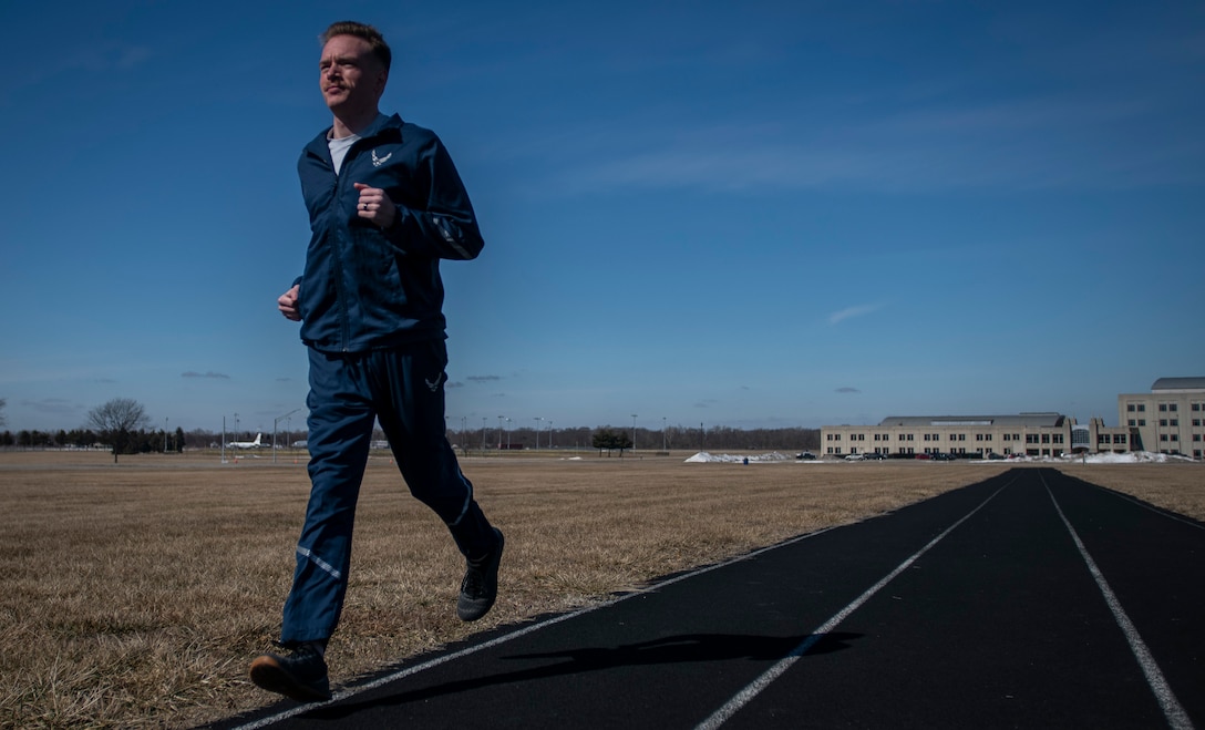 Air Force Uniform Office member 2nd Lt. Maverick Wilhite puts parts of the updated Air Force physical training (PT) uniform through their paces at Wright-Patterson Air Force Base, Ohio, Feb. 25, 2021. The Air Force Uniform Office is part of the Human System's Division in the Air Force Life Cycle Management Center's Agile Combat Support Directorate. This is the first update to the PT uniform in more than 16 years, and over 150 Airmen participated in testing the new gear. The new ensemble currently consists of a jacket, a pair of pants, a T-shirt and two types of shorts; a lined runner's short and a longer unlined multipurpose short. A long sleeve t-shirt and a hoodie are in development. The ensemble features improved fabrics that are softer and quick drying, and have antimicrobial technology, which helps with moisture and odor control. The new uniform items are entering the production phase and will be available to Airmen sometime in 2022. (U.S. Air Force photo by Jim Varhegyi)