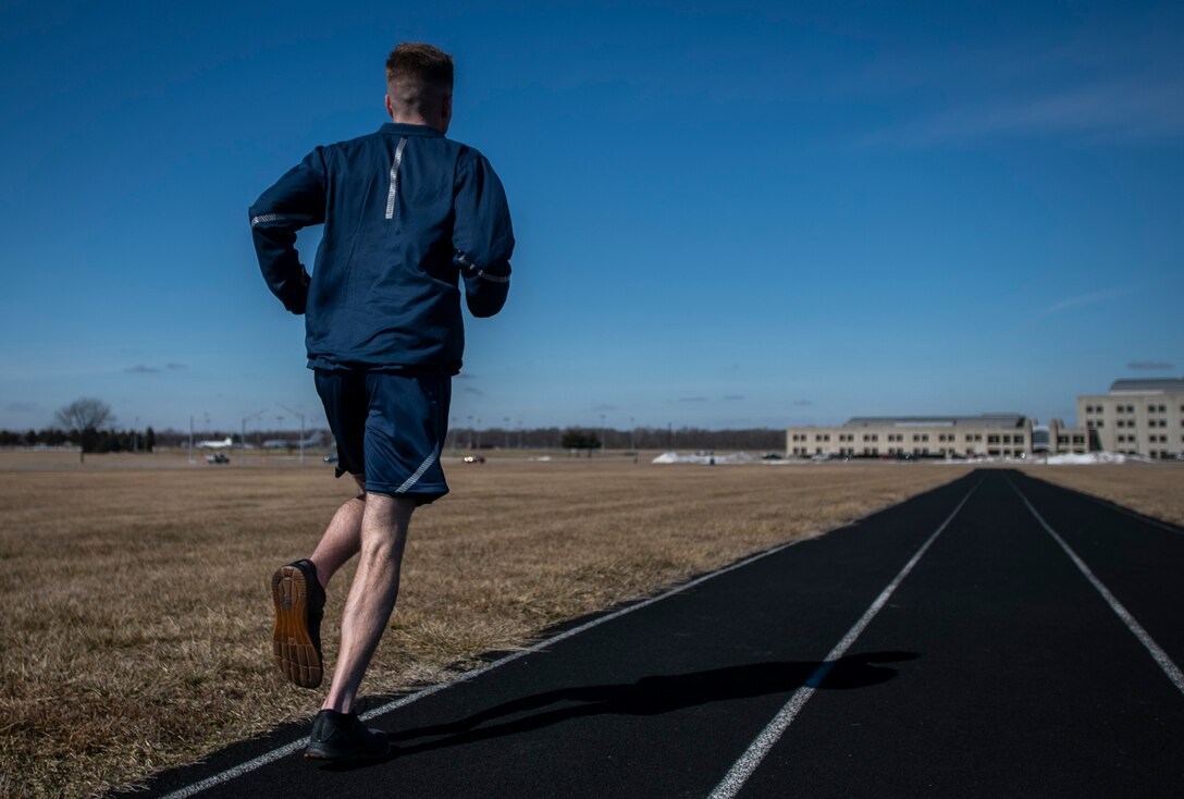 Air Force Uniform Office member 2nd Lt. Maverick Wilhite puts parts of the updated Air Force physical training (PT) uniform through their paces at Wright-Patterson Air Force Base, Ohio, Feb. 25, 2021. The Air Force Uniform Office is part of the Human System's Division in the Air Force Life Cycle Management Center's Agile Combat Support Directorate. This is the first update to the PT uniform in more than 16 years, and over 150 Airmen participated in testing the new gear. The new ensemble currently consists of a jacket, a pair of pants, a T-shirt and two types of shorts; a lined runner's short and a longer unlined multipurpose short. A long sleeve t-shirt and a hoodie are in development. The ensemble features improved fabrics that are softer and quick drying, and have antimicrobial technology, which helps with moisture and odor control. The new uniform items are entering the production phase and will be available to Airmen sometime in 2022. (U.S. Air Force photo by Jim Varhegyi)