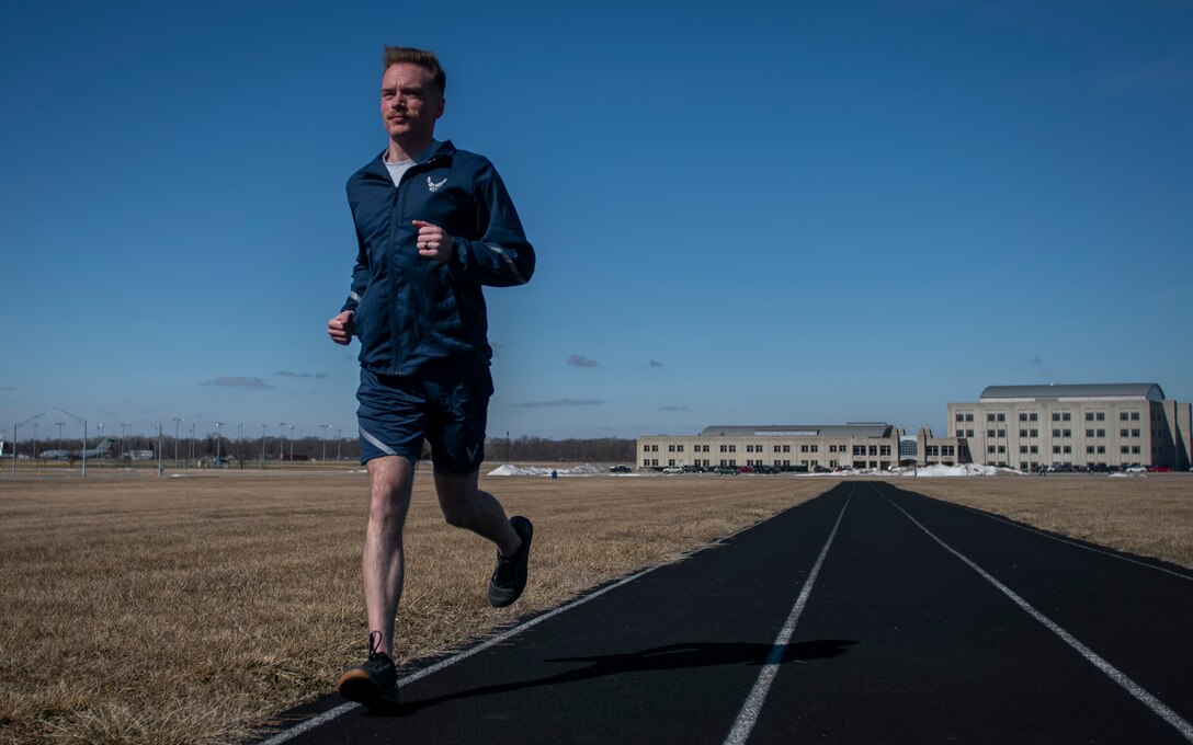 Air Force Uniform Office member 2nd Lt. Maverick Wilhite puts parts of the updated Air Force physical training (PT) uniform through their paces at Wright-Patterson Air Force Base, Ohio, Feb. 25, 2021. The Air Force Uniform Office is part of the Human System's Division in the Air Force Life Cycle Management Center's Agile Combat Support Directorate. This is the first update to the PT uniform in more than 16 years, and over 150 Airmen participated in testing the new gear. The new ensemble currently consists of a jacket, a pair of pants, a T-shirt and two types of shorts; a lined runner's short and a longer unlined multipurpose short. A long sleeve t-shirt and a hoodie are in development. The ensemble features improved fabrics that are softer and quick drying, and have antimicrobial technology, which helps with moisture and odor control. The new uniform items are entering the production phase and will be available to Airmen sometime in 2022. (U.S. Air Force photo by Jim Varhegyi)