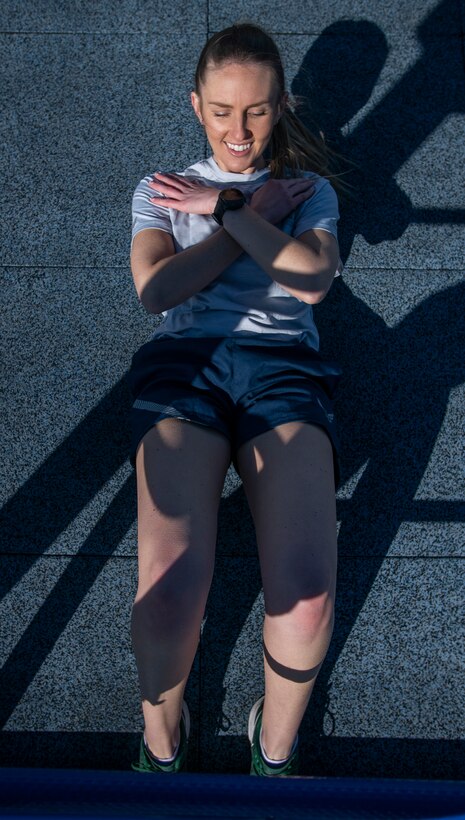 Air Force Uniform Office member 1st Lt. Avery Thompson puts parts of the updated Air Force phyisical training (PT) uniform through their paces at Wright-Patterson Air Force Base, Ohio, Feb. 25, 2021. The Air Force Uniform Office is part of the Human System's Division in the Air Force Life Cycle Management Center's Agile Combat Support Directorate. This is the first update to the PT uniform in more than 16 years, and over 150 Airmen participated in testing the new gear. The new ensemble currently consists of a jacket, a pair of pants, a T-shirt and two types of shorts; a lined runners short and a longer unlined multipurpose short. A long sleeve t-shirt and a hoodie are in development. The ensemble features improved fabrics that are softer and quick drying, and have antimicrobial technology, which helps with moisture and odor control. The new uniform items are entering the production phase and will be available to Airmen sometime in 2022. (U.S. Air Force photo by Jim Varhegyi)