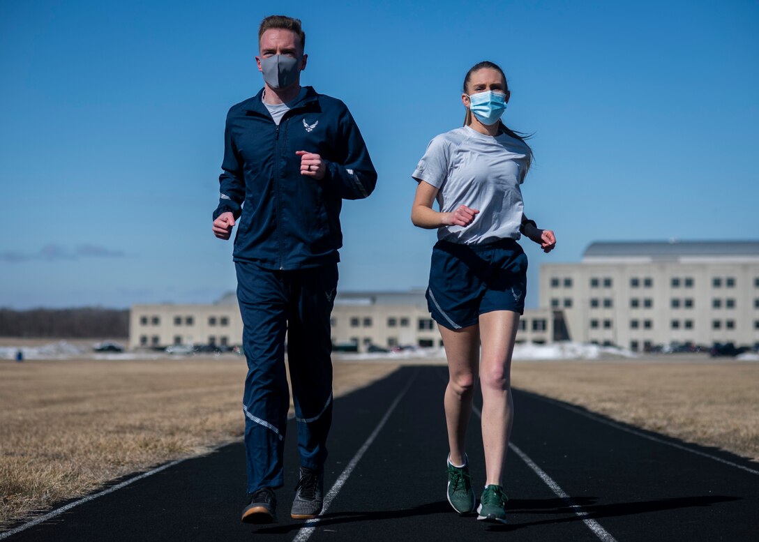 Air Force Uniform Office members 1st Lt. Avery Thomson and 2nd Lt. Maverick Wilhite put updated versions of the Air Force physical training (PT) uniform through their paces at Wright-Patterson Air Force Base, Ohio, Feb. 25, 2021.  The Air Force Uniform Office is part of the Human System's Division in the Air Force Life Cycle Management Center's Agile Combat Support Directorate. This is the first update to the PT uniform in more than 16 years, and over 150 Airmen participated in testing the new gear. The new ensemble currently consists of a jacket, a pair of pants, a T-shirt and two types of shorts; a lined runner's short and a longer unlined multipurpose short. A long sleeve t-shirt and a hoodie are in development. The ensemble features improved fabrics that are softer and quick drying, and have antimicrobial technology, which helps with moisture and odor control. The new uniform items are entering the production phase and will be available to Airmen sometime in 2022. (U.S. Air Force photo by Jim Varhegyi)