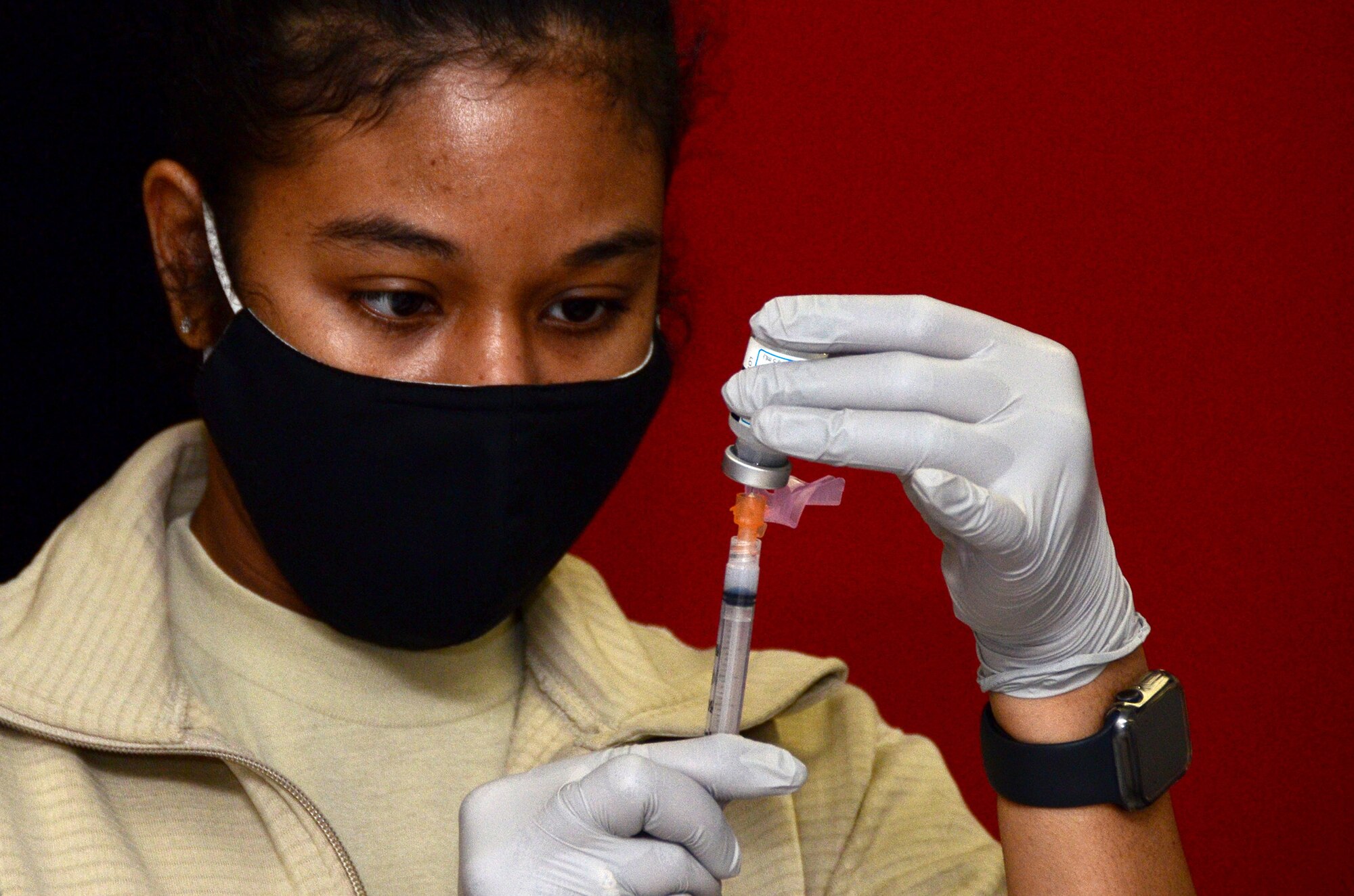 Tech. Sgt. Kathleen Burden, 445th Aerospace Medicine Squadron medical service craftsman, prepares the Moderna COVID-19 Vaccine for Reserve Citizen Airmen from the 445th Airlift Wing Feb. 26, 2021. Each vile contains 10 doses of the COVID-19 vaccine. To prevent the spread of COVID-19, Airmen were given staggered time slots and maintained physical distancing per Centers for Disease, Control and Prevention guidelines. (U.S. Air Force photo/Mr. Darrell Sydnor)