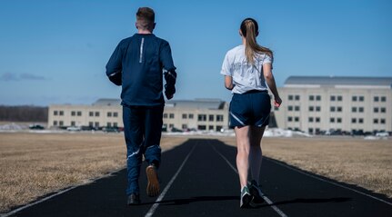 Air Force Uniform Office members 1st Lt. Avery Thomson and 2nd Lt. Maverick Wilhite put updated versions of the Air Force physical training (PT) uniform through their paces at Wright-Patterson Air Force Base, Ohio, Feb. 25, 2021.  The Air Force Uniform Office is part of the Human System's Division in the Air Force Life Cycle Management Center's Agile Combat Support Directorate. This is the first update to the PT uniform in more than 16 years, and over 150 Airmen participated in testing the new gear. The new ensemble currently consists of a jacket, a pair of pants, a T-shirt and two types of shorts; a lined runner's short and a longer unlined multipurpose short. A long sleeve t-shirt and a hoodie are in development. The ensemble features improved fabrics that are softer and quick drying, and have antimicrobial technology, which helps with moisture and odor control. The new uniform items are entering the production phase and will be available to Airmen sometime in 2022. (U.S. Air Force photo by Jim Varhegyi)