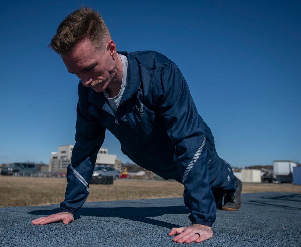 Air Force Uniform Office member 2nd Lt. Maverick Wilhite puts parts of the updated Air Force phyisical training (PT) uniform through their paces at Wright-Patterson Air Force Base, Ohio, Feb. 25, 2021. The Air Force Uniform Office is part of the Human System's Division in the Air Force Life Cycle Management Center's Agile Combat Support Directorate. This is the first update to the PT uniform in more than 16 years, and over 150 Airmen participated in testing the new gear. The new ensemble currently consists of a jacket, a pair of pants, a T-shirt and two types of shorts; a lined runner's short and a longer unlined multipurpose short. A long sleeve t-shirt and a hoodie are in development. The ensemble features improved fabrics that are softer and quick drying, and have antimicrobial technology, which helps with moisture and odor control. The new uniform items are entering the production phase and will be available to Airmen sometime in 2022. (U.S. Air Force photo by Jim Varhegyi)