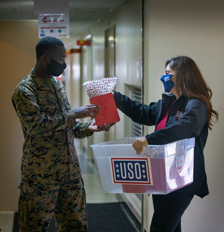 U.S. Navy Petty Officer 3rd Class Andrews Frimpong, a hospital corpsman with 3rd Medical Battalion, 3rd Marine Logistics Group, receives a customized gift during Operation Valentine on Camp Foster, Okinawa, Japan, Feb. 11, 2020. Operation Valentine serves as an avenue to keep service members and loved ones connected by delivering them personalized Valentine's Day gifts requested by their families. Frimpong is a native of Accra, Ghana. (U.S. Marine Corps photo by Lance Cpl. Alex Fairchild)