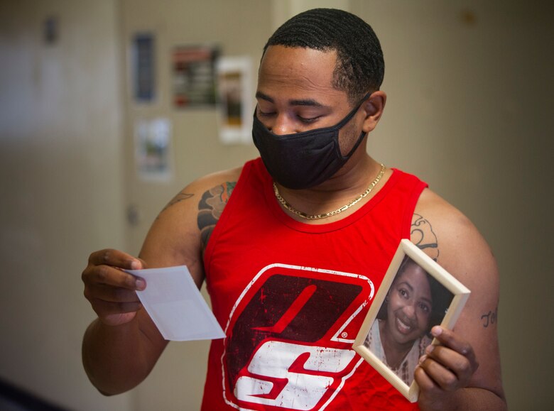 U.S. Marine Corps Cpl. Marcellus Stepeny, a motor transportation operator with 3rd Medical Battalion, 3rd Marine Logistics Group, opens a customized gift during Operation Valentine on Camp Foster, Okinawa, Japan, Feb. 11, 2020. Operation Valentine serves as an avenue to keep service members and loved ones connected by delivering them personalized Valentine's Day gifts requested by their families. Stepeny is a native of Memphis, Tennessee. (U.S. Marine Corps photo by Lance Cpl. Alex Fairchild)