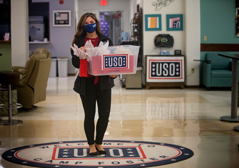 Alejandra Kwiatkowski, the United Service Organizations (USO) Camp Foster field programs manager, poses with customized gifts during “Operation Valentine” on Camp Foster, Okinawa, Japan, Feb. 11, 2020. Operation Valentine serves as an avenue to keep service members and loved ones connected by delivering them personalized Valentine's Day gifts requested by their families. Kwiatkowski is a native of Moscow, Idaho. (U.S. Marine Corps photo by Lance Cpl. Alex Fairchild)