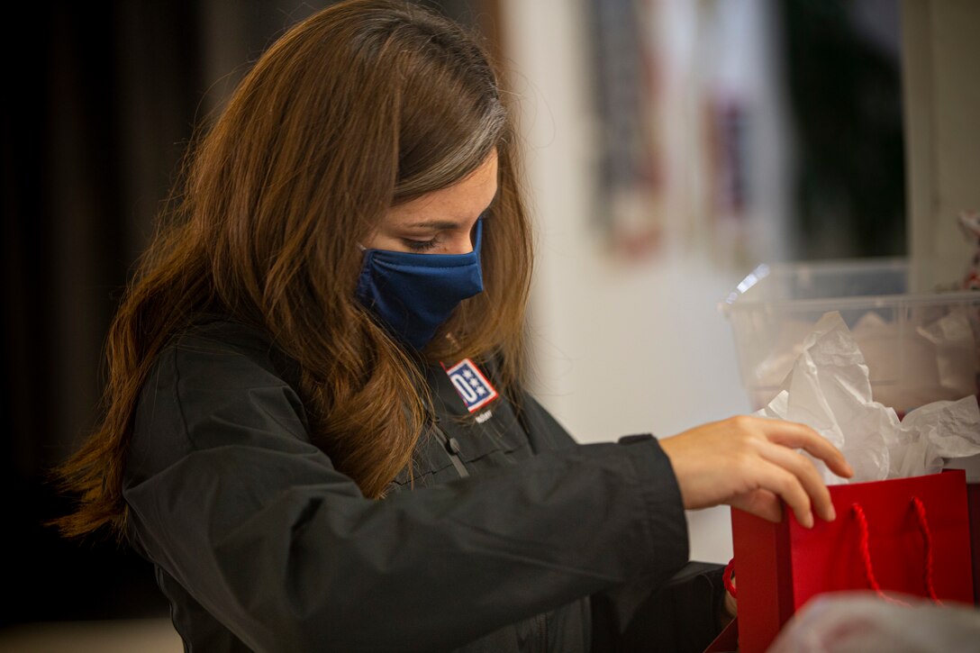 Alejandra Kwiatkowski, the United Service Organizations (USO) Camp Foster field programs manager, prepares gifts to deliver to service members during Operation Valentine on Camp Foster, Okinawa, Japan, Feb. 11, 2020. Operation Valentine serves as an avenue to keep service members and loved ones connected by delivering them personalized Valentine's Day gifts requested by their families. Kwiatkowski is a native of Moscow, Idaho. (U.S. Marine Corps photo by Lance Cpl. Alex Fairchild)