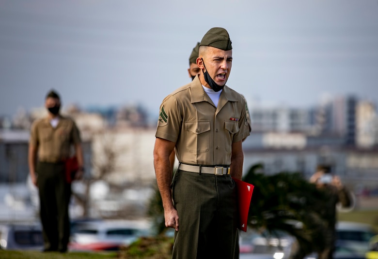 U.S. Marine Corps Cpl. Justin Kirschner, a with Headquarters and Support (H&S) Battalion, sings the Marine’s Hymn upon graduating on Camp Foster, Okinawa, Japan, Jan. 14, 2021. The purpose of Corporals’ Course, hosted by H&S Battalion, Marine Corps Installations Pacific – Marine Corps Base Camp Smedley D. Butler, is to provide corporals with the education and leadership skills necessary to lead Marines. The program of instruction places emphasis on leadership foundations and a working knowledge of general military subjects. (U.S. Marine Corps photo by Lance Cpl. Shelby A. Karr)