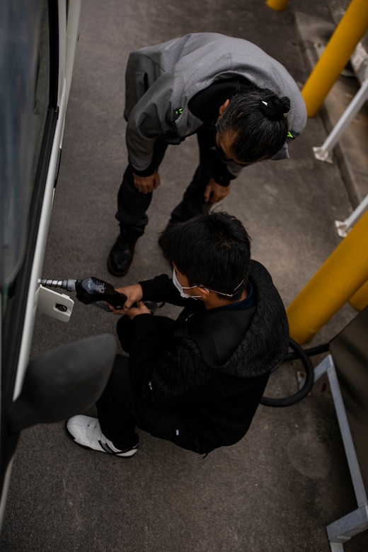 Members of the U.S. military community refuel their vehicle at a defense fuel supply point (DFSP) on Camp Foster, Okinawa, Japan, Jan. 14, 2021. A DFSP on Okinawa allows III Marine Expeditionary Force to stay ready at a moment’s notice. Bulk fuel supports all types of transportation fuel for the variety of U.S. military vehicles on Okinawa. (U.S. Marine Corps photo by Lance Cpl. Shelby A. Karr)