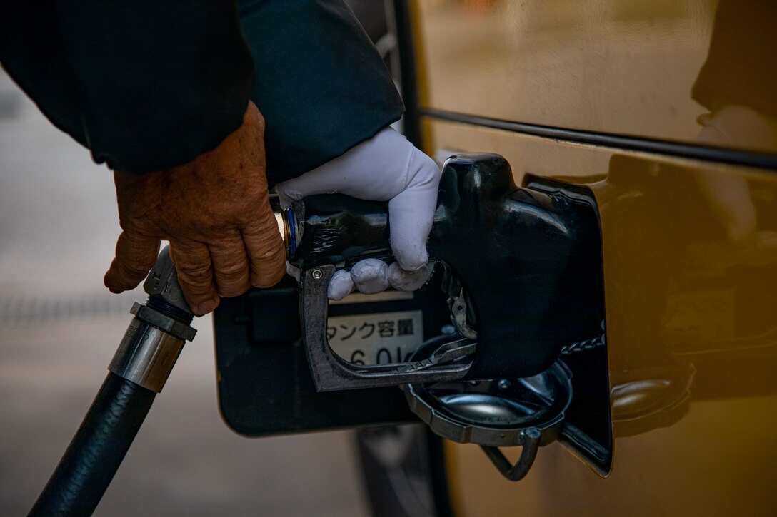 A member of the U.S. military community fills up his vehicle at a defense fuel supply point (DFSP) on Camp Foster, Okinawa, Japan, Jan. 13, 2021. A DFSP on Okinawa allows III Marine Expeditionary Force to stay ready at a moment’s notice. Bulk fuel supports all types of transportation fuel for the variety of U.S. military vehicles on Okinawa. (U.S. Marine Corps photo by Lance Cpl. Shelby A. Karr)