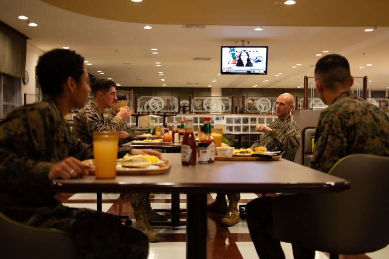 U.S. Marines with Headquarters and Support Battalion, Marine Corps Installations Pacific, Marine Corps Base Camp Smedley D. Butler, converse during the Commanding Officer and Sergeant Major breakfast in Camp Foster’s Chow Hall on Jan. 5, 2021. Col. Jeffrey L. Hammond Commanding Officer, and Sgt.Maj. Brian R. Drechsler Sergeant Major, of Headquarters and Support Battalion has come together for breakfast every Tuesday for the last six months to provide guidance to Marines.