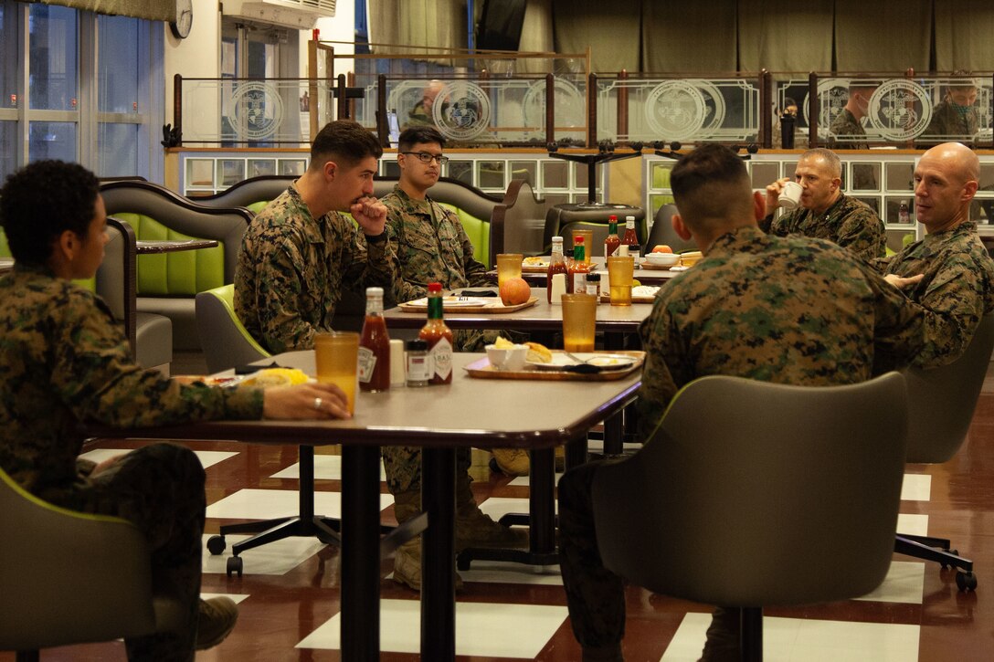 U.S. Marines with Headquarters and Support Battalion, Marine Corps Installations Pacific, Marine Corps Base Camp Smedley D. Butler, converse during the Commanding Officer and Sergeant Major breakfast in Camp Foster’s Chow Hall on Jan. 5, 2021. The Commanding Officer and Sergeant Major of Headquarters and Support Battalion has come together for breakfast every Tuesday for the last six months to provide guidance to Marines.