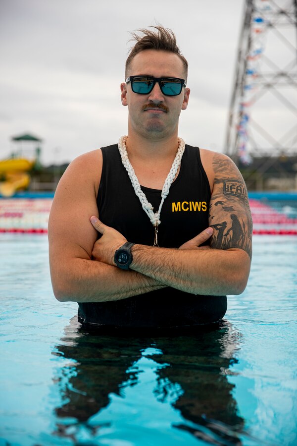U.S. Navy Petty Officer 2nd Class Kody Schwartz, a utilitiesman second class with U.S. Navy Seabees, Headquarters and Support Battalion poses for a photo at Camp Foster, Okinawa, Japan, Jan. 29, 2021. Schwartz is utilities maintenance, a Marine Corps Instructor of Water Survival, and Sexual Assault Prevention and Response advocate which makes him a vital asset to Marine Corps Installations Pacific. Schwartz is native to Hutchison, Minnesota. (U.S. Marine Corps photo by Lance Cpl. Zachary Larsen)