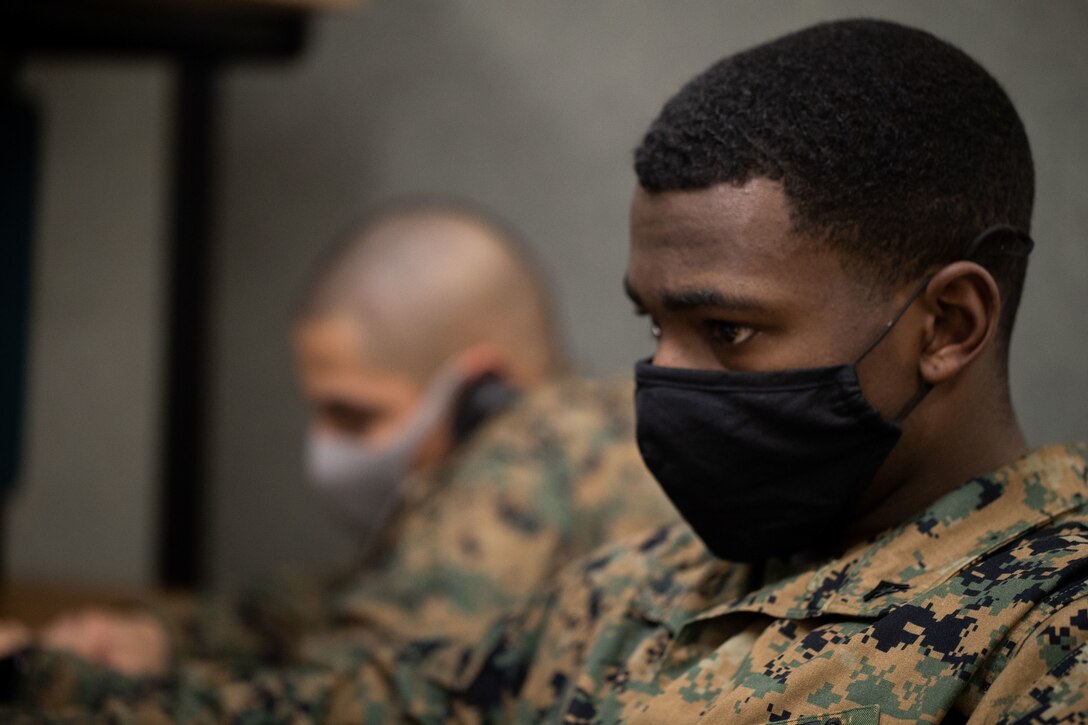 U.S. Marine Corps Lance Cpl. Zabian P. Jones, a distribution management specialist, native to Atlanta, Georgia, with Alpha Company, Headquarters and Support Battalion, Marine Corps Installations Pacific, Marine Corps Base Camp Butler, searches for Port Calls at the Passenger Travel Office on Camp Foster on Jan. 15, 2021. The Passenger Travel Office is committed to providing excellent customer service for daily Permanent Change of Station and Temporary Additional Duty travel needs for service members, Department of Defense civilians, and their families. (U.S. Marine Corps photo by Sgt. Christopher D. Thompson)
