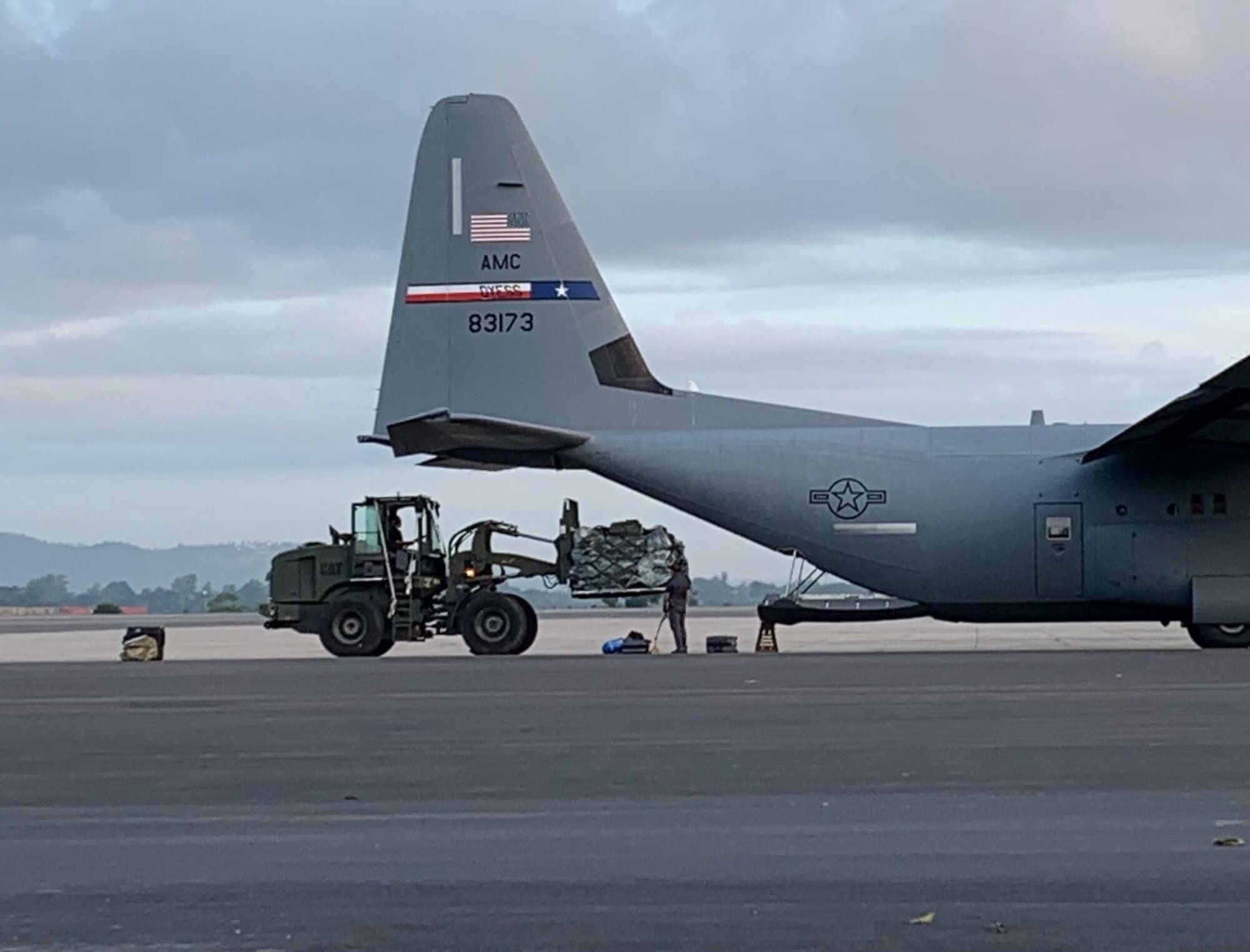 U.S. Air Force Airmen assigned to the 435th Air Expeditionary Wing load a U.S Air Force C-130J Super Hercules aircraft during Operation Octave Quartz