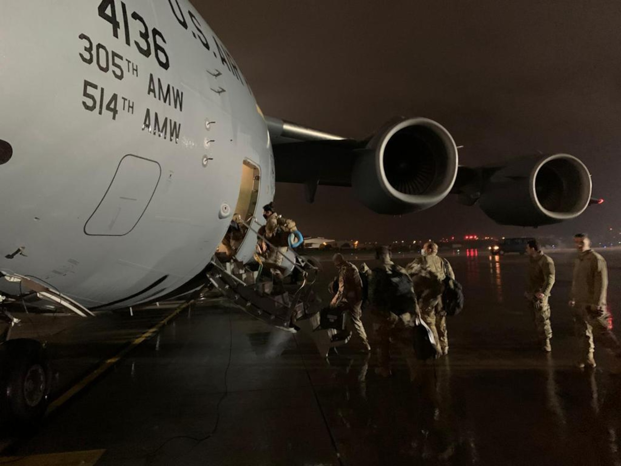 U.S. Air Force Airmen assigned to the 435th Air Expeditionary Wing board a U.S Air Force C-130J Super Hercules aircraft during Operation Octave Quartz