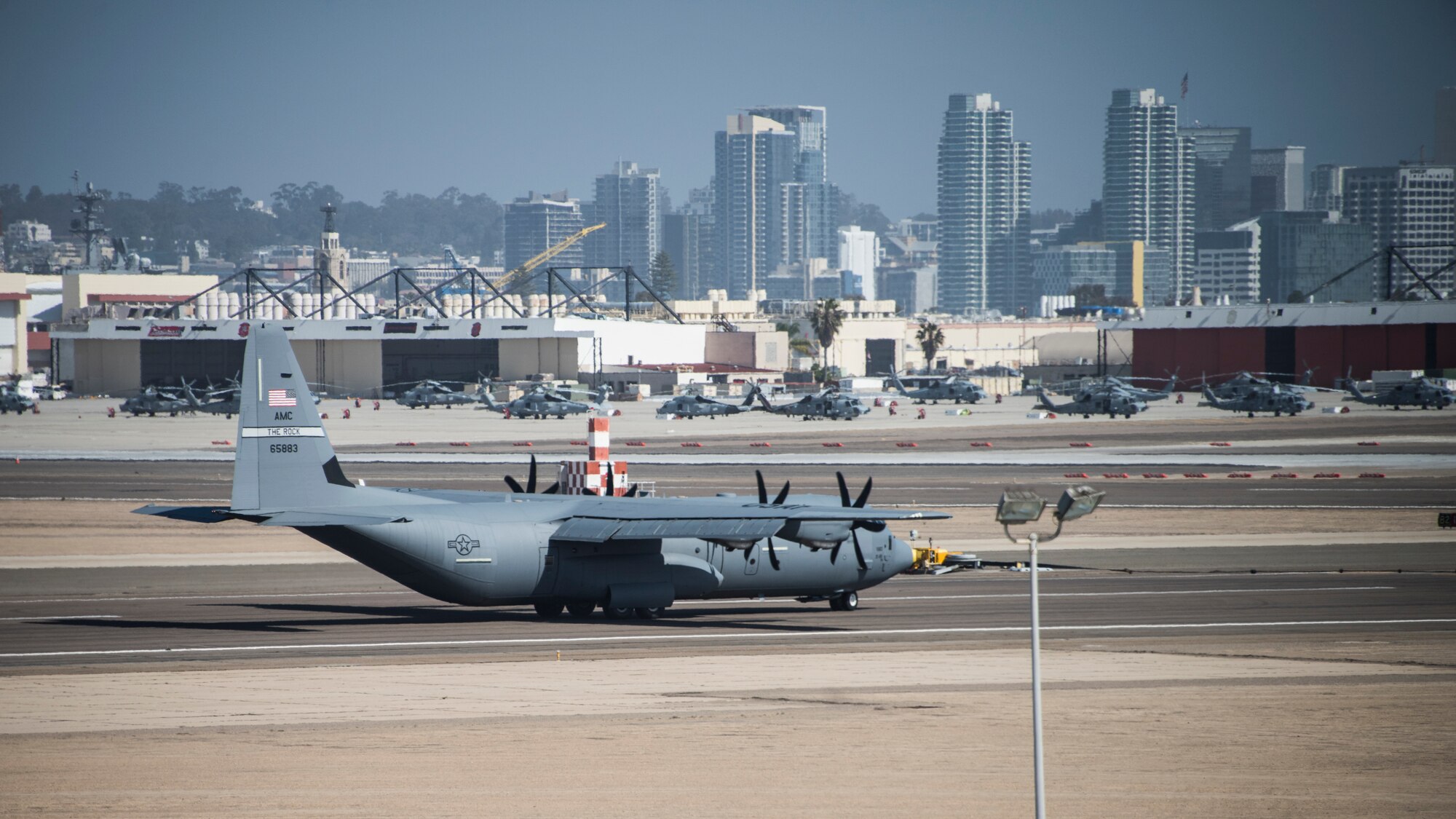 A photo of a C-130 on the taxi way