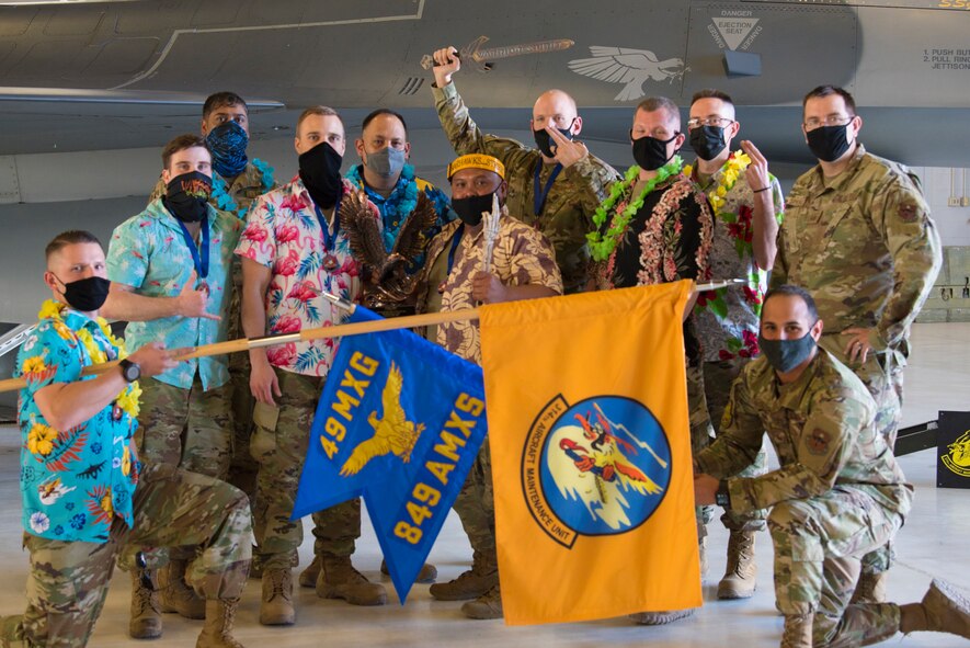 The 314th Aircraft Maintenance Unit Airmen pose for a picture after winning Aircraft Maintenance Unit of the Year, during the 2020 Maintenance Professional of the Year Awards, Feb. 26, 2021, on Holloman Air Force Base, New Mexico. The MPOY ceremony is a long-running tradition in the maintenance career field that acknowledges that year's top performing Airmen and the hard work of maintenance personnel throughout the year. (U.S. Air Force Photo by Airman 1st Class Jessica Sanchez)