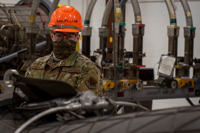 Senior Airman Derrick Radzieski, 4th Component Maintenance Squadron aerospace propulsion technician, inspects an F-15E Strike Eagle engine at Seymour Johnson Air Force Base, North Carolina, Feb. 2, 2021.
