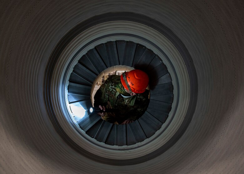 Senior Airman Derrick Radzieski, 4th Component Maintenance Squadron aerospace propulsion technician, works on an F-15E Strike Eagle engine at Seymour Johnson Air Force Base, North Carolina, Feb. 2, 2021.