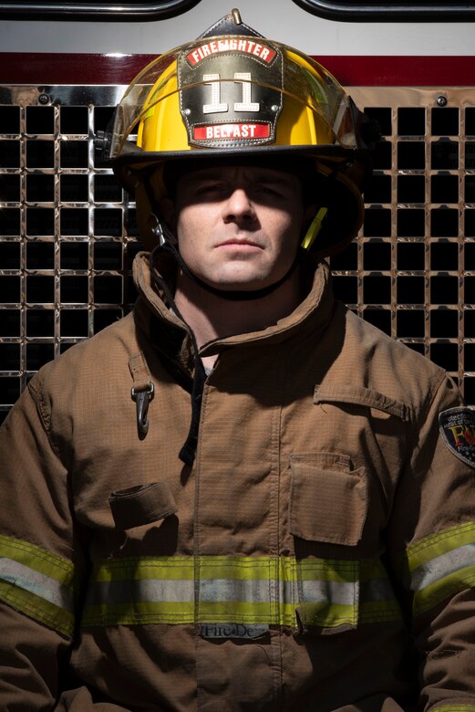 Senior Airman Derrick Radzieski, 4th Component Maintenance Squadron aerospace propulsion technician, stands in front of a fire engine at Seymour Johnson Air Force Base, North Carolina, Feb. 24, 2021.